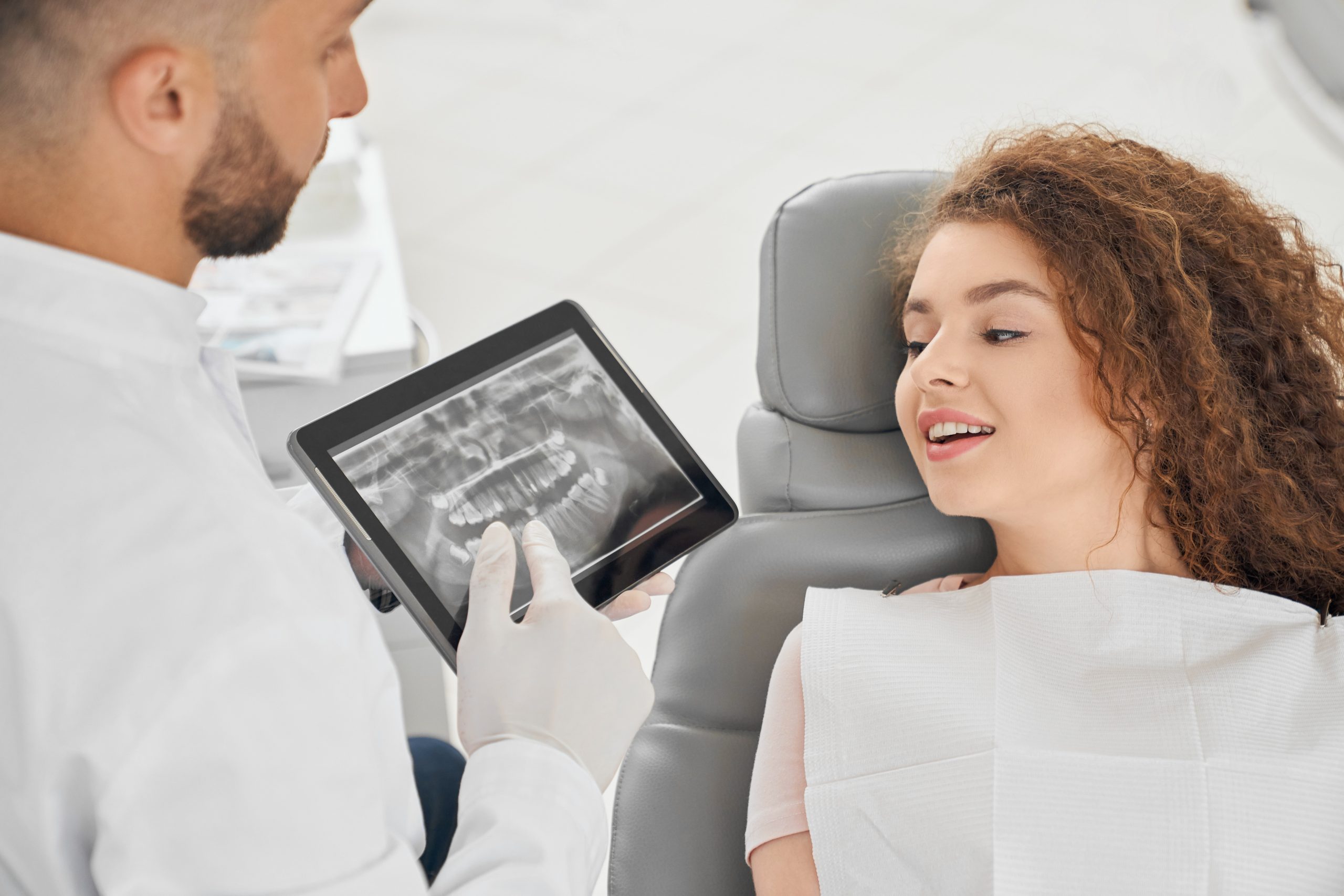 Dentist showing dental implants